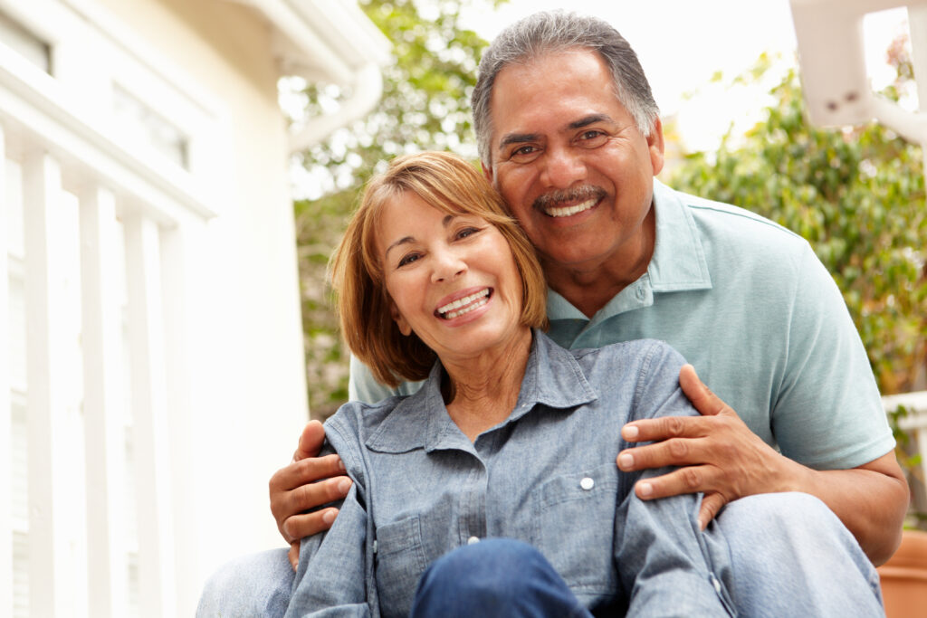 A man holding a woman with his hands